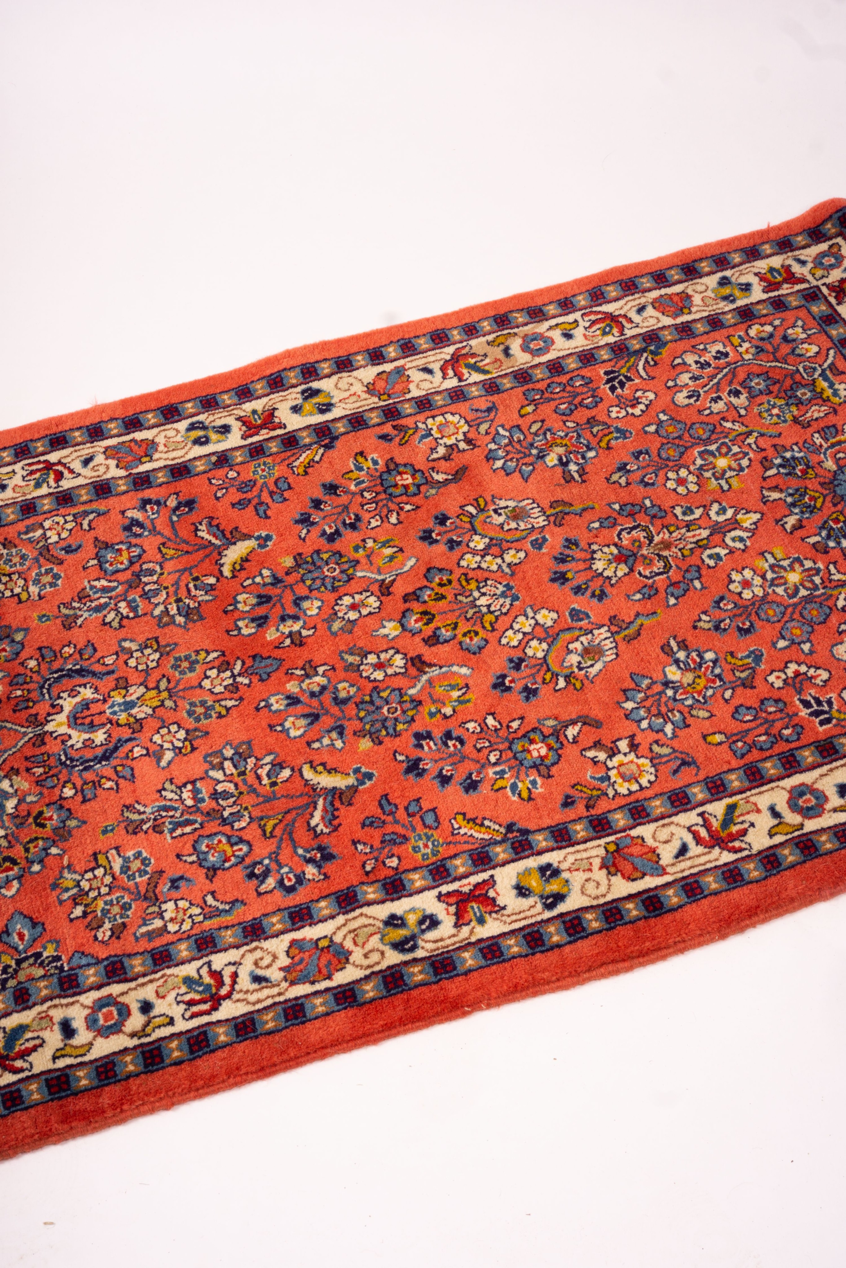 A Persian red ground runner, 202 x 83cm